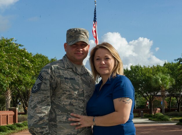 Chief Master Sgt. Chad Ballance, superintendent of the 628th Medical Group, and Amber Ballance pose together outside of the Joint Base Charleston headquarters building August 9, 2016, in Charleston S.C. They are the only known Department of Defense couple who have donated bone marrow and blood stem cells to unrelated matches. Bone marrow and blood stem cell transplantation are used to treat patients with diseases affecting the blood or immune systems. (U.S. Air Force photo/Airman 1st Class Kevin West)