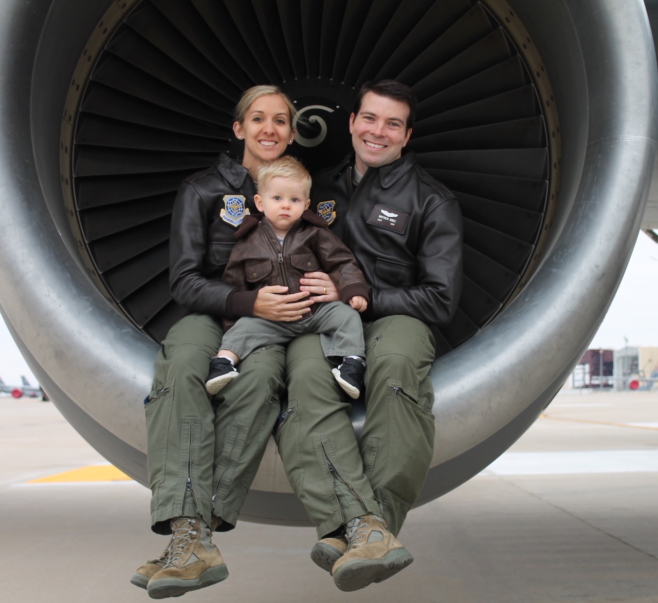 Capt. Chrystina Jones, left, 350th Air Refueling Squadron pilot, and Maj. Matt Jones, 349th ARS pilot, pose with their son, Dec. 2015, at McConnell Air Force Base, Kan. They both “refuel the fight” as KC-135 Stratotanker pilots, an aircraft that first took flight for the first time 60 years ago. (Courtesy photo)