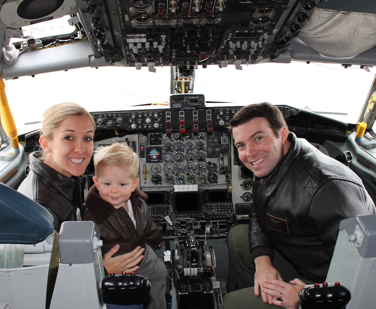 Capt. Chrystina Jones, left, 350th Air Refueling Squadron pilot, and Maj. Matt Jones, 349th ARS pilot, pose with their son, Dec. 2015, at McConnell Air Force Base, Kan. They once flew the C-130 Hercules but currently “refuel the fight” as KC-135 Stratotanker pilots, an aircraft that first took flight 60 years ago. (Courtesy photo)