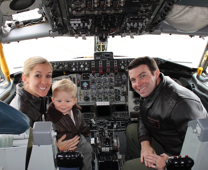 Capt. Chrystina Jones, left, 350th Air Refueling Squadron pilot, and Maj. Matt Jones, 349th ARS pilot, pose with their son, Dec. 2015, at McConnell Air Force Base, Kan. They once flew the C-130 Hercules but currently “refuel the fight” as KC-135 Stratotanker pilots, an aircraft that first took flight 60 years ago. (Courtesy photo)
