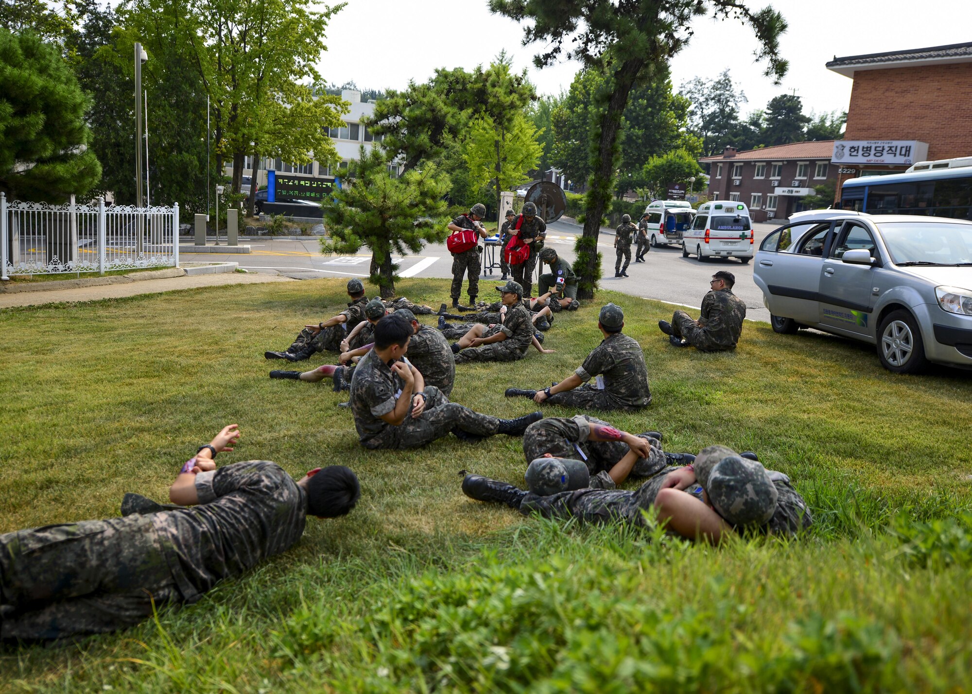 Republic of Korea air force airmen simulate injuries during a joint mass-casualty medical exercise at Osan Air Base, Republic of Korea, Aug. 22, 2016. ROKAF medical personnel worked alongside 51st Medical Group personnel to triage and transport patients to medical facilities while exchanging practices and techniques between the two groups. (U.S. Air Force photo by Senior Airman Victor J. Caputo)