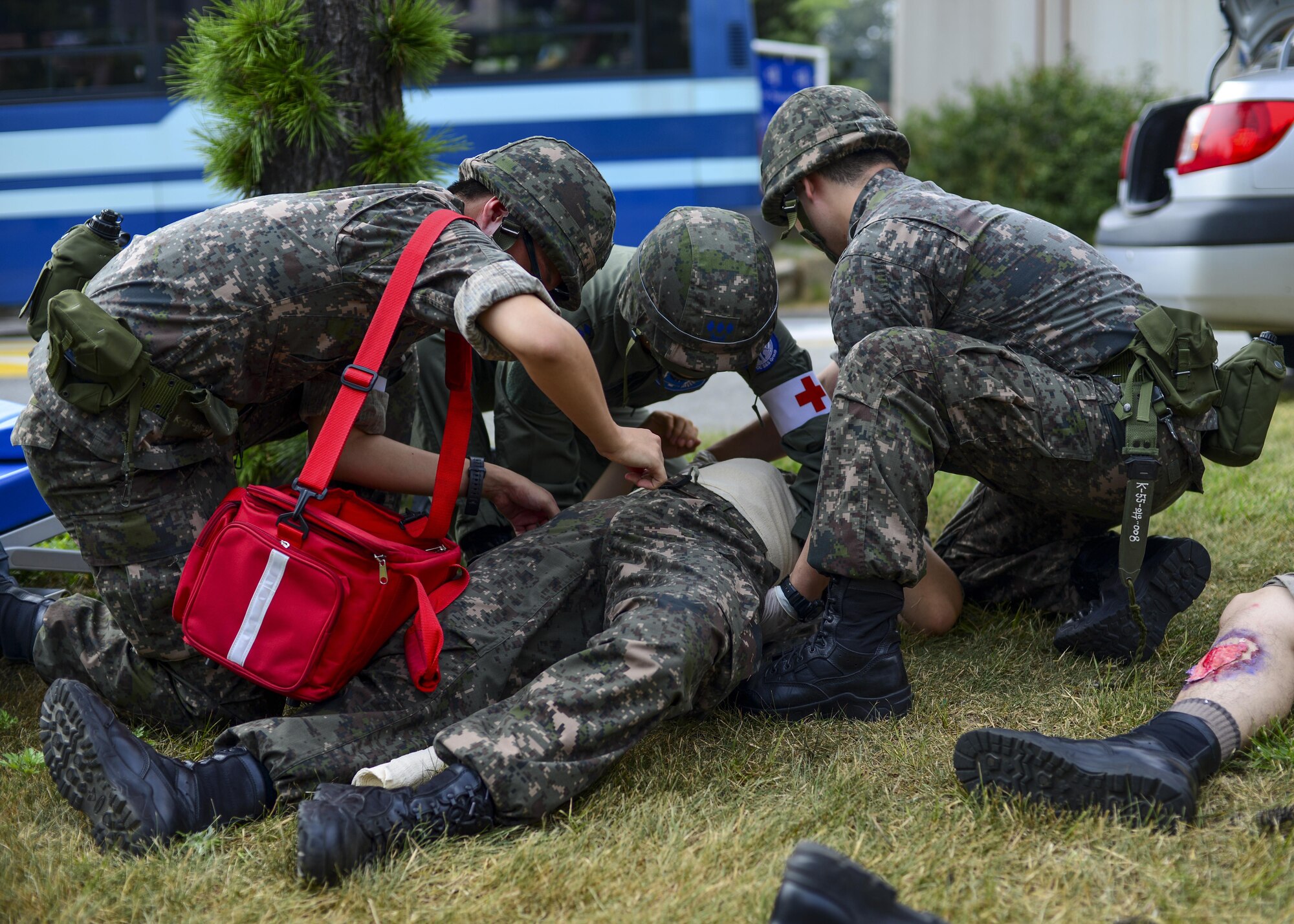 Republic of Korea air force medical personnel treat the victim of a simulated bombing during a joint mass-casualty medical exercise at Osan Air Base, Republic of Korea, Aug. 22, 2016. The mass-casualty scenario provided an opportunity for ROKAF personnel to work side-by-side with 51st Medical Group medics to triage and transport simulated victims to a medical facility. (U.S. Air Force photo by Senior Airman Victor J. Caputo)