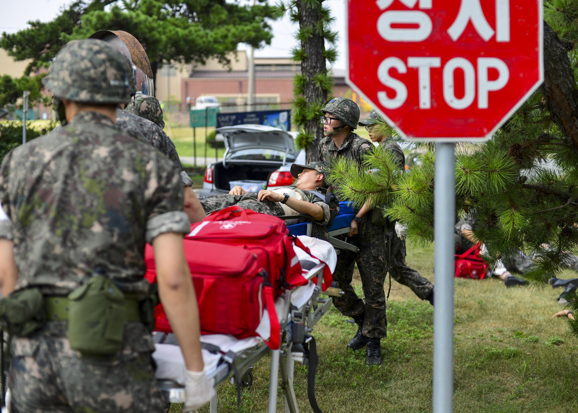 Republic of Korea air force medical personnel transport the victim of a simulated bombing on a gurney during a joint mass-casualty medical exercise at Osan Air Base, Republic of Korea, Aug. 22, 2016. The ROKAF medics worked with 51st Medical Group personnel during the exercise to learn the U.S. Air Force way of responding before updating their standard operating procedures. (U.S. Air Force photo by Senior Airman Victor J. Caputo)