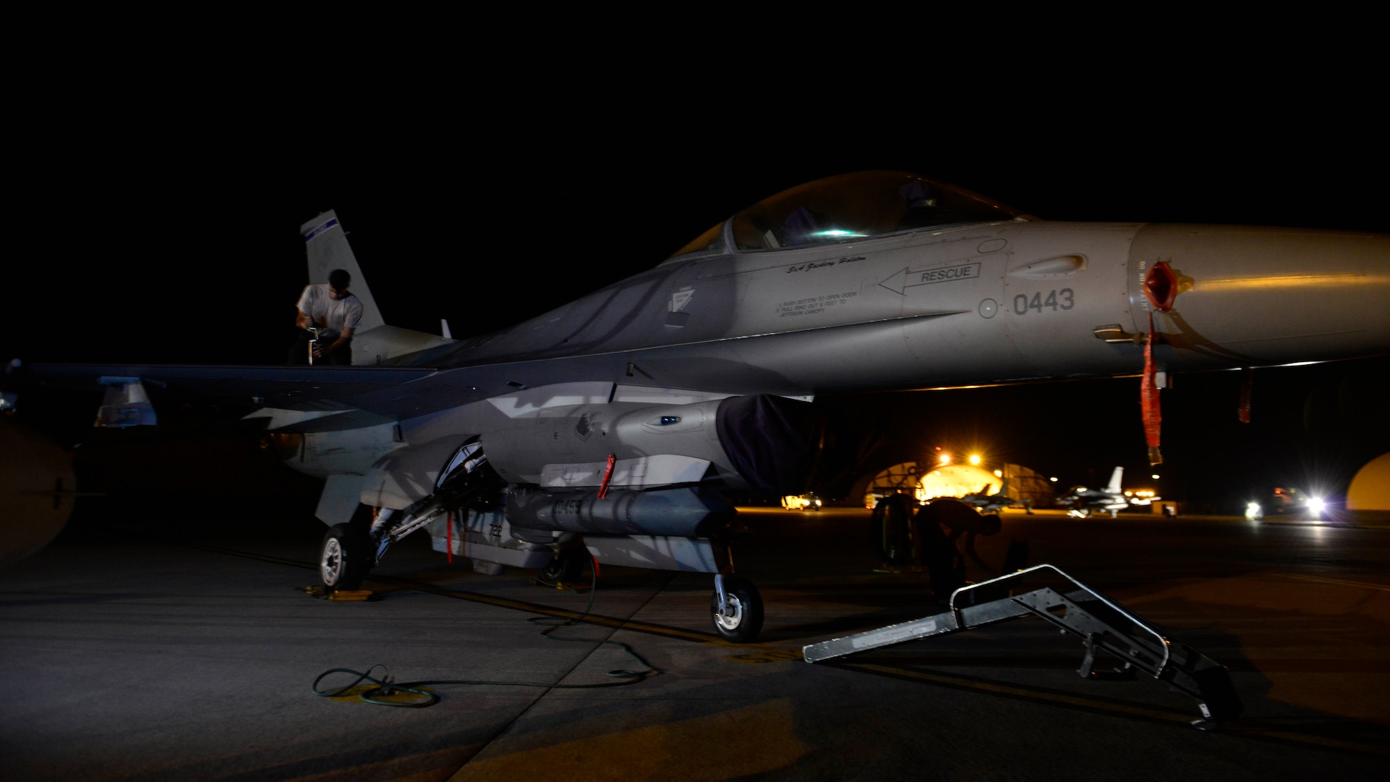 Airman 1st Class Christian Lamb, 31st Aircraft Maintenance Squadron crew chief, tightens a bolt on an F-16 Fighting Falcon, Aug. 24, 2016 at Aviano Air Base, Italy. At night, swing maintenance provides the majority of the aircraft maintenance after daytime flights are finished. (U.S. Air Force photo by Airman 1st Class Cary Smith/Released)