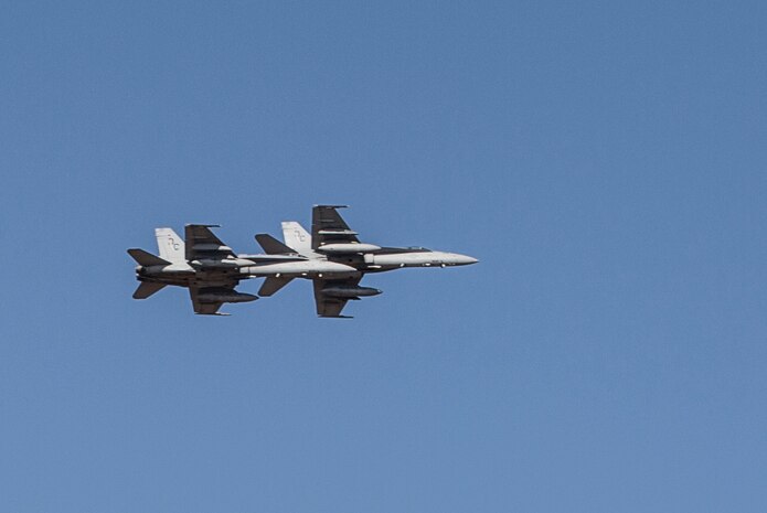 Two F/A-18C Hornets with Marine Fighter Attack Squadron (VMFA) 122 fly over head during Southern Frontier at Royal Australian Air Force Base Tindal, Australia, Aug. 31, 2016. The Hornet squadron trained in low-altitude tactics, building pilots’ confidence and skills with low flying while performing air-to-surface maneuvers simultaneously. Southern Frontier is a three week unit level training helping pilots gain experience and qualifications in low-altitude tactics, close air support, and air ground, high explosive ordnance delivery. (U.S. Marine Corps photo by Cpl. Nicole Zurbrugg)