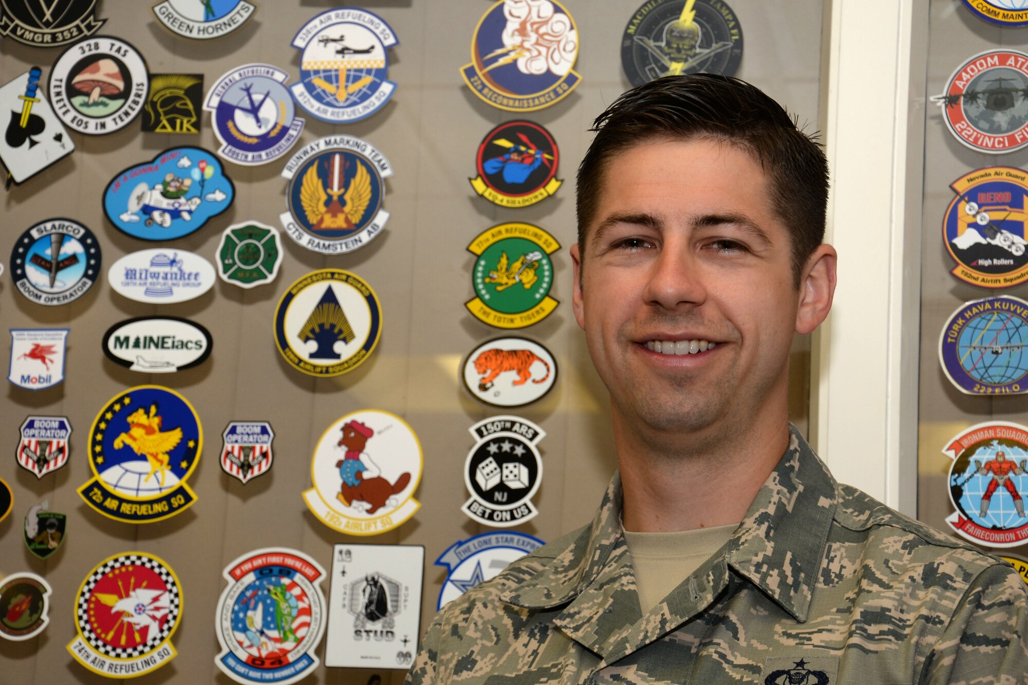 U.S. Air Force Tech. Sgt. Joshua Johnson, 100th Operations Support Squadron NCO in charge of Airfield Management training, poses for a photograph in the aircrew lounge Aug. 11, 2016, on RAF Mildenhall, England. Johnson practices the 100th Air Refueling Wing’s vision of ‘Ready, Balanced, Better.’ (U.S. Air Force photo by Gina Randall)