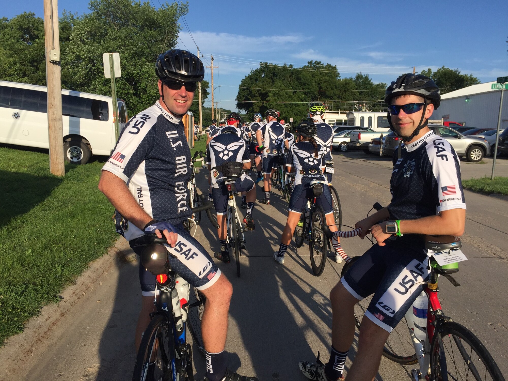 U.S. Air Force Tech. Sgt. Joshua Johnson, right, 100th Operations Support Squadron NCO in charge of Airfield Management training, poses for a photograph during a cycling event July 24, 2016, in Glenwood, Iowa. The annual event took place in July and honored veterans with a special stage ceremony and a 21 gun salute by the American legion. (Courtesy photo)
