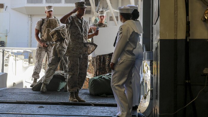 Pfc. Luis Moreno, a combat engineer with 7th Engineer Support Battalion, 1st Marine Logistics Group, I Marine Expeditionary Force, requests permission to board the USS America at Naval Base San Diego, Calif., Aug. 29, 2016. The ship will carry Marines, Sailors, and Coast Guardsmen to Los Angeles Fleet Week, Sept. 2 – Sept. 5. Fleet Weeks are annual patriotic events where active Navy and Coast Guard ships dock in major U.S. cities giving Marines, sailors and Coast Guardsmen an opportunity to interact with locals. This is the first year L.A. has hosted an official Fleet Week event.