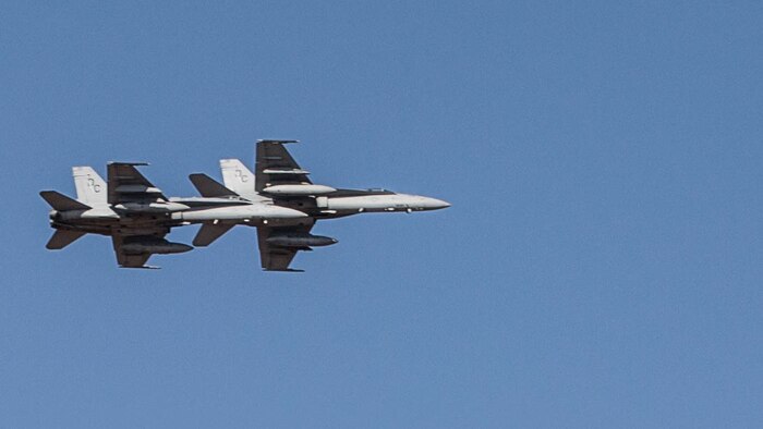 Two F/A-18C Hornets with Marine Fighter Attack Squadron (VMFA) 122 fly over head during Southern Frontier at Royal Australian Air Force Base Tindal, Australia, Aug. 31, 2016. The Hornet squadron trained in low-altitude tactics, building pilots’ confidence and skills with low flying while performing air-to-surface maneuvers simultaneously. Southern Frontier is a three week unit level training helping pilots gain experience and qualifications in low-altitude tactics, close air support, and air ground, high explosive ordnance delivery. 