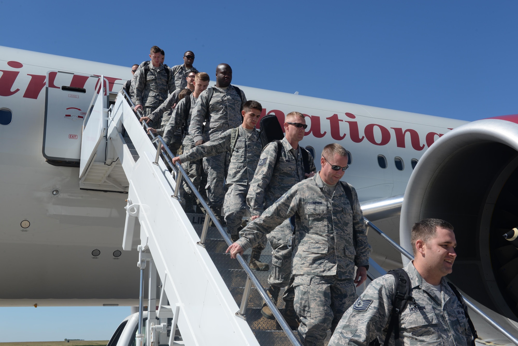 Approximately 300 Airmen return from a deployment at Minot Air Force Base, N.D., Aug. 29, 2016. The Airmen, who were supporting the continuous bomber presence at Andersen AFB, Guam, were greeted by coworkers, friends and family. (U.S. Air Force Photo/Airman 1st Class Jessica Weissman)