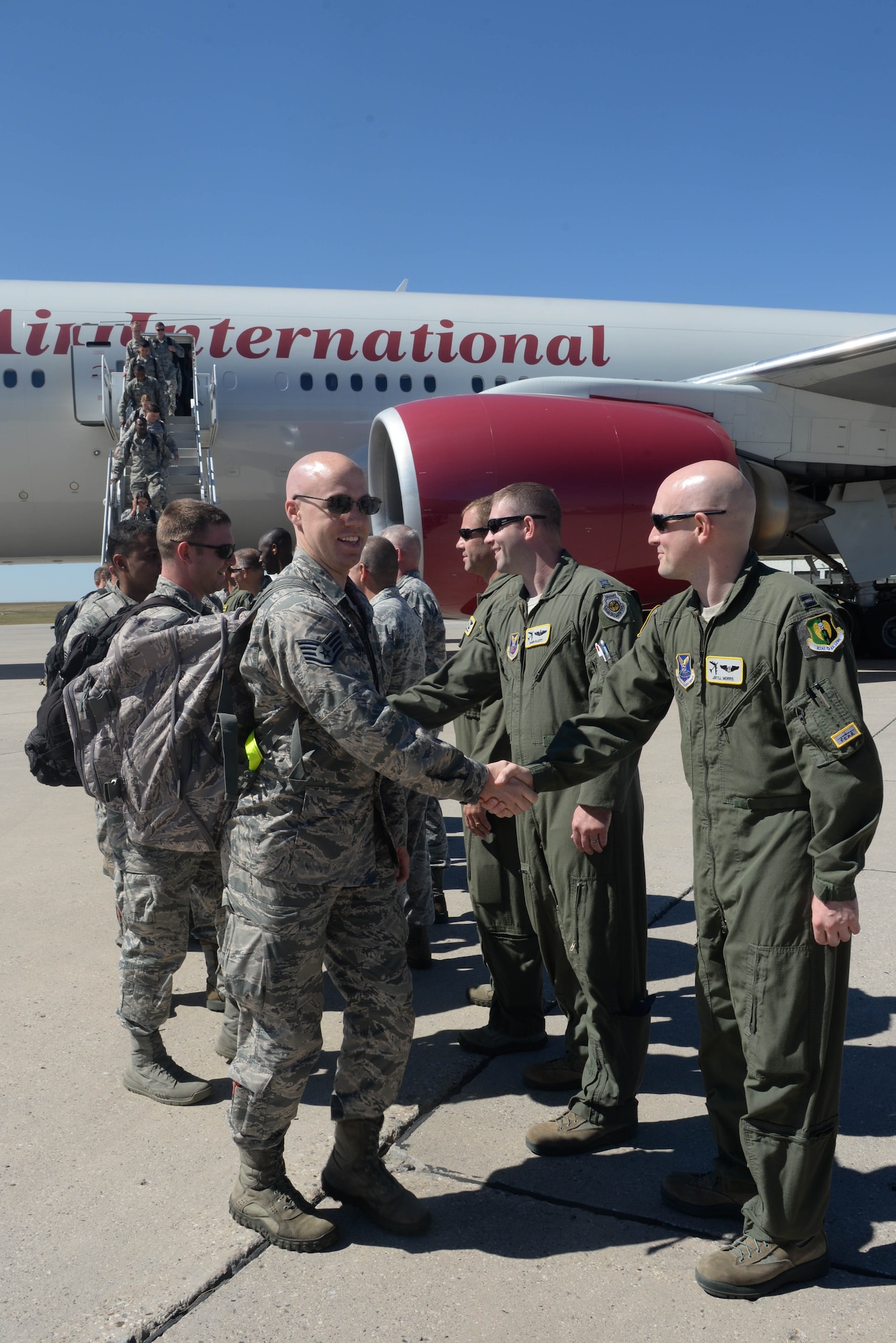 Base leadership welcomes Airmen home from a deployment at Dock 9 at Minot Air Force Base, N.D., Aug. 29, 2016. This continuous bomber presence deployment is the last rotation to Andersen AFB, Guam for a while. (U.S. Air Force Photo/Airman 1st Class Jessica Weissman)