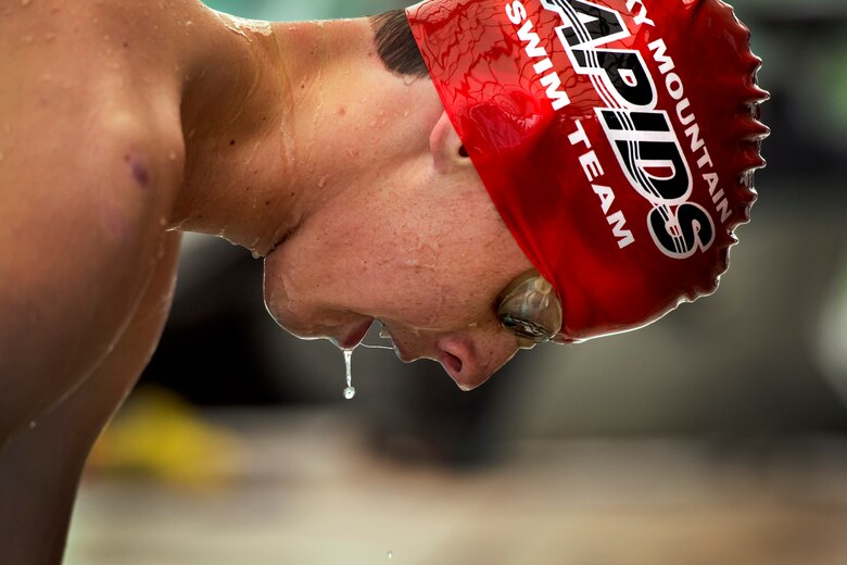 Water drips off Wyatt Owen while he catches his breath following his 400-meter swim in the 12th annual Schriever Air Force Base, Colorado, Friday, Aug. 26, 2016. Owen finished fifth in the event, which also included a 12-mile bike ride and 3.1-mile run, with a time of 1:11:49. (U.S. Air Force photo/Dennis Rogers)