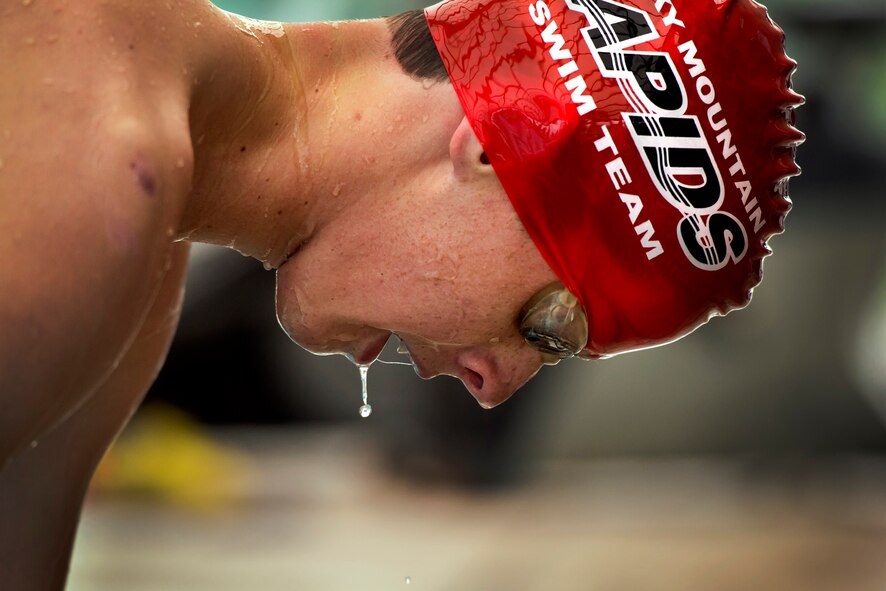 Water drips off Wyatt Owen while he catches his breath following his 400-meter swim in the 12th annual Schriever Air Force Base, Colorado, Friday, Aug. 26, 2016. Owen finished fifth in the event, which also included a 12-mile bike ride and 3.1-mile run, with a time of 1:11:49. (U.S. Air Force photo/Dennis Rogers)