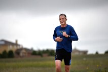 Zach Owen, 3rd Space Experimentation Squadron, flashes a ‘3’ for 3 SES just before crossing the finish line in the 12th annual Schriever Air Force Base Triathlon at Schriever Air Force Base, Colorado, Friday, Aug. 26, 2016. Owen represented 3 SES well this summer winning both the duathlon and triathlon for the squadron. (U.S. Air Force photo/Dennis Rogers)