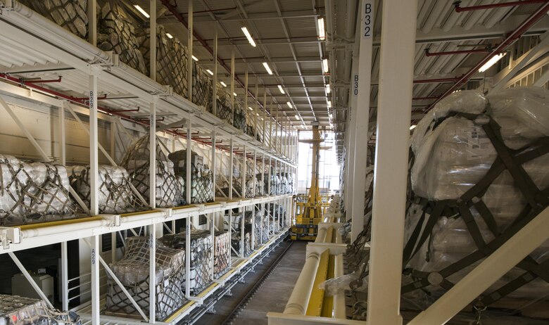 Jim Bailey, Denton logistics manager (left), cross checks the upcoming mission details with Ken Hundemer, Denton operations manager (right), in the Denton program office on Joint Base Charleston, S.C., Aug. 30. The Denton program works with nonprofit organizations to send medical equipment and supplies, nonperishable foods, education materials, hygienic supplies and vehicles to countries in need around the world. (U.S. Air Force photo/Airman 1st Class Thomas T. Charlton)
