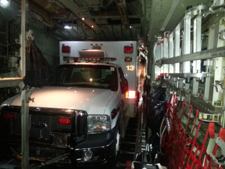 An aircrew from the 357th Airlift Squadron from Maxwell Air Force Base transports an ambulance from Ohio to Oaxaca, Mexico on the flightline of Joint Base Charleston – Air Base, S.C., Aug. 30, 2016. This ambulance is being donated through the Denton program and will help five local communities providing transportation to any hospital within a one hour radius. (Courtesy photo)