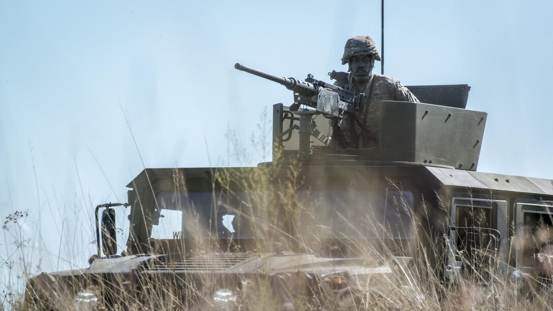 U.S. Army 173rd Airborne Brigade paratroopers provide airfield clearance during a joint airborne operation near Aviano Air Base, Italy, Aug. 24, 2016. The U.S. Army 173rd Airborne Brigade and German Army 1st Airborne Brigade paratroopers practiced a variety of tactics to increase knowledge of each other’s operating procedures and improve integration between the two units. (U.S. Air Force photo by Airman 1st Class Cory W. Bush/Released)