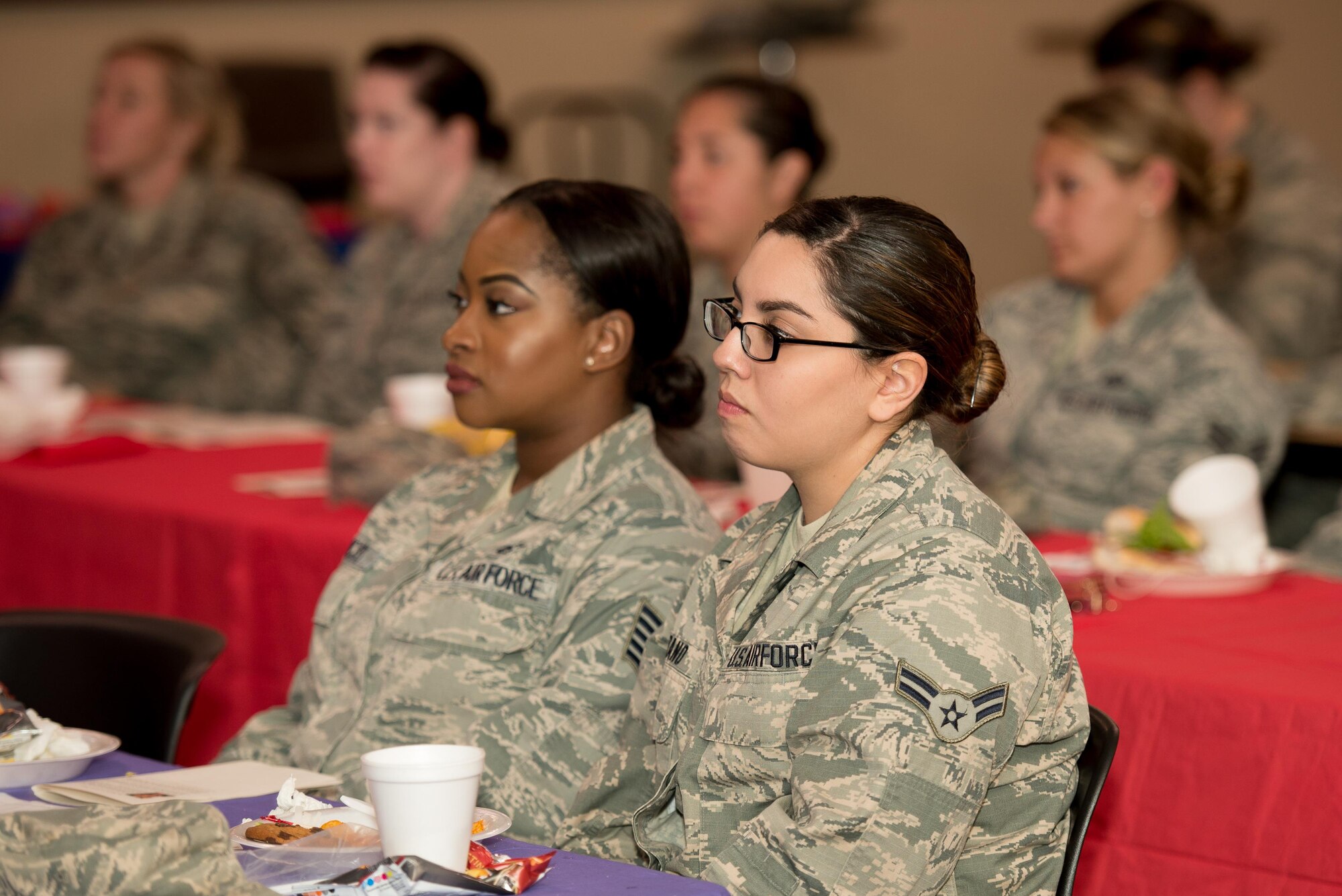 Airmen listen to the speaking panel at the Women's Equality Day luncheon on Aug. 25, 2016, at Dover Air Force Base, Del. The gathering celebrated the 96-year anniversary of the ratification of the 19th Amendment to the U.S. Constitution, allowing women to vote. (U.S. Air Force photo by Mauricio Campino)
