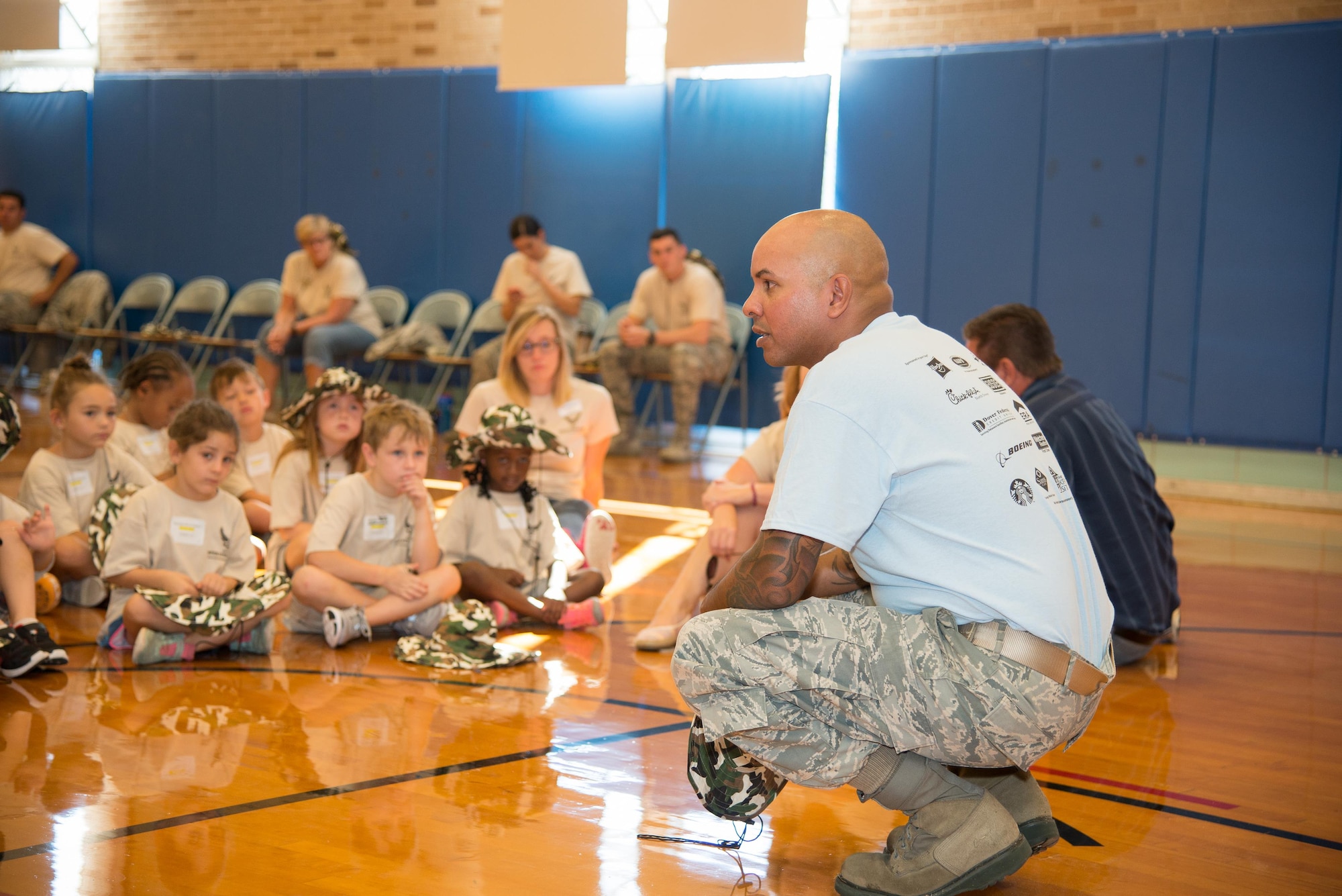 Master Sgt. Ruben Mojica, Master Sgt. Ruben Mojica, 436th Force Support Squadron Airman & Family Readiness Center readiness NCO in charge, gives a pre-deployment brief during the Kids/Teachers Understanding Deployment Operations event Aug. 23, 2016, at Dover Air Force Base. The annual event helps school age children of active duty service members and their teachers understand what it's like to deploy overseas. (U.S. Air Force photo by Mauricio Campino)