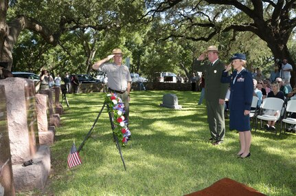 Brig. Gen. Heather L. Pringle (right), 502nd Air Base Wing and Joint Base San Antonio commander, and Russ Whitlock (center), Lyndon B. Johnson National Historical Park superintendent, salute the grave of President Lyndon B. Johnson Aug. 27 during a wreath-laying ceremony at LBJ National Historical Park. This year’s event honored what would have been the 108th anniversary of President Johnson’s birth. 