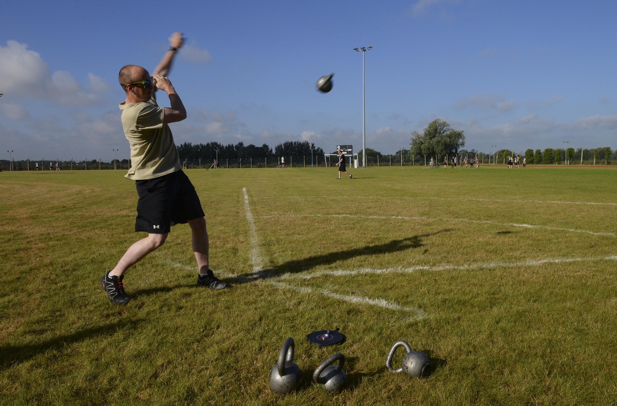 An Air commando from the 352d Special Operations Wing throws a kettle bell during the Highland Games Sports and Family Day Aug. 26, 2016, on RAF Mildenhall, England. Other sporting events held during the competition included a leadership relay, dodgeball, shot-put, ultimate rugby, caber toss and an obstacle course relay. (U.S. Air Force photo by Staff Sgt. Micaiah Anthony)