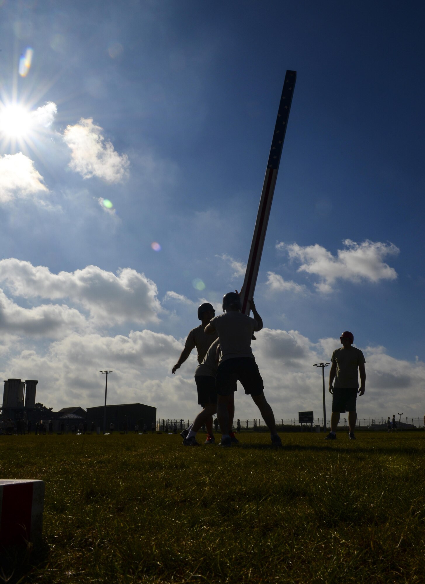 Air commandos from the 352d Special Operations Wing prepare to throw a caber during the Highland Games Sports and Family Day Aug. 26, 2016, on RAF Mildenhall, England. The event was held to foster friendly competition between units, promote team work and boost morale. (U.S. Air Force photo by Staff Sgt. Micaiah Anthony)