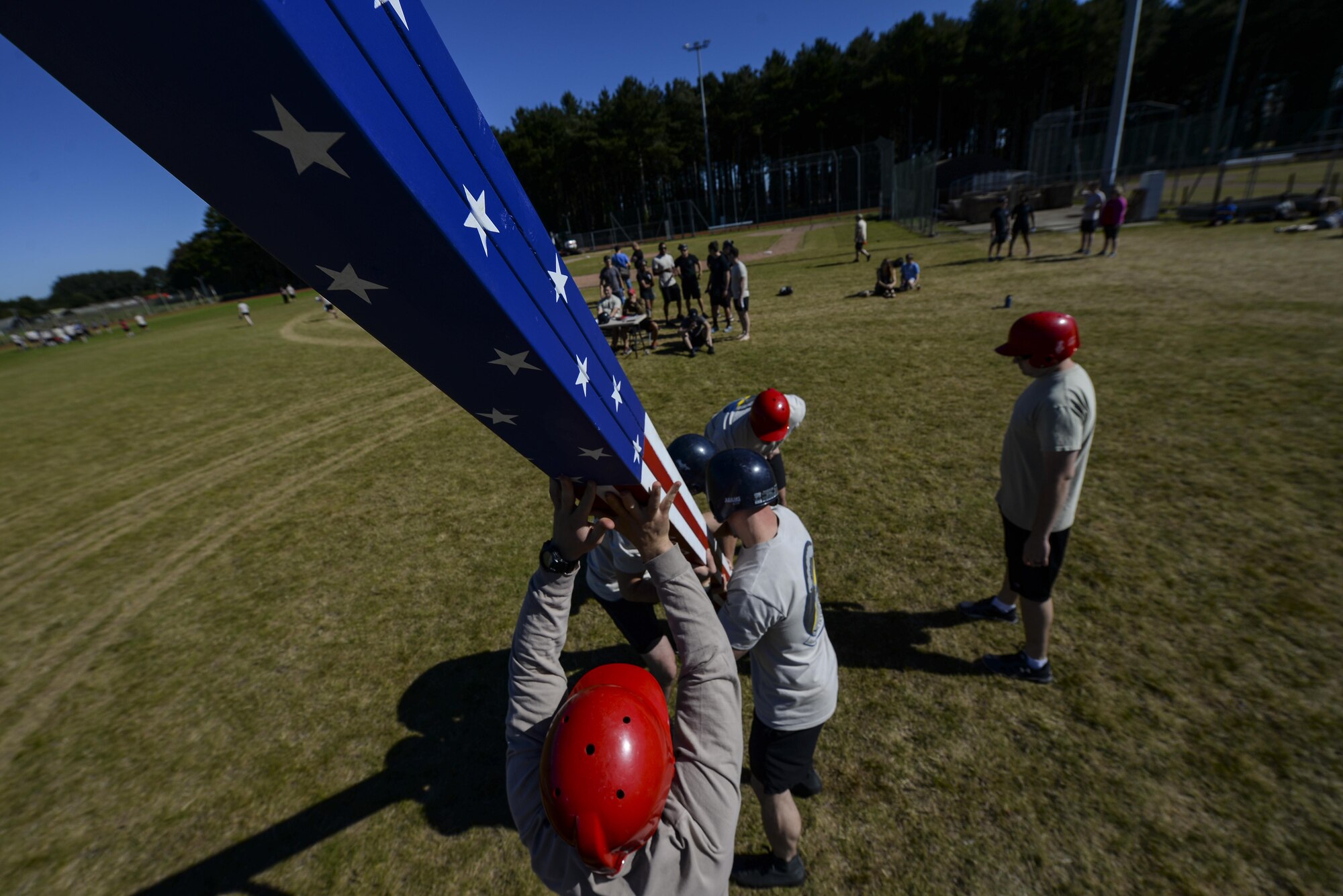 Air commandos from the 352d Special Operations Wing prepare to throw a caber during the Highland Games Sports and Family Day Aug. 26, 2016, on RAF Mildenhall, England. Other sporting events held during the competition included a leadership relay, dodgeball, shot-put, ultimate rugby, kettle bell throw and an obstacle course relay. (U.S. Air Force photo by Staff Sgt. Micaiah Anthony)