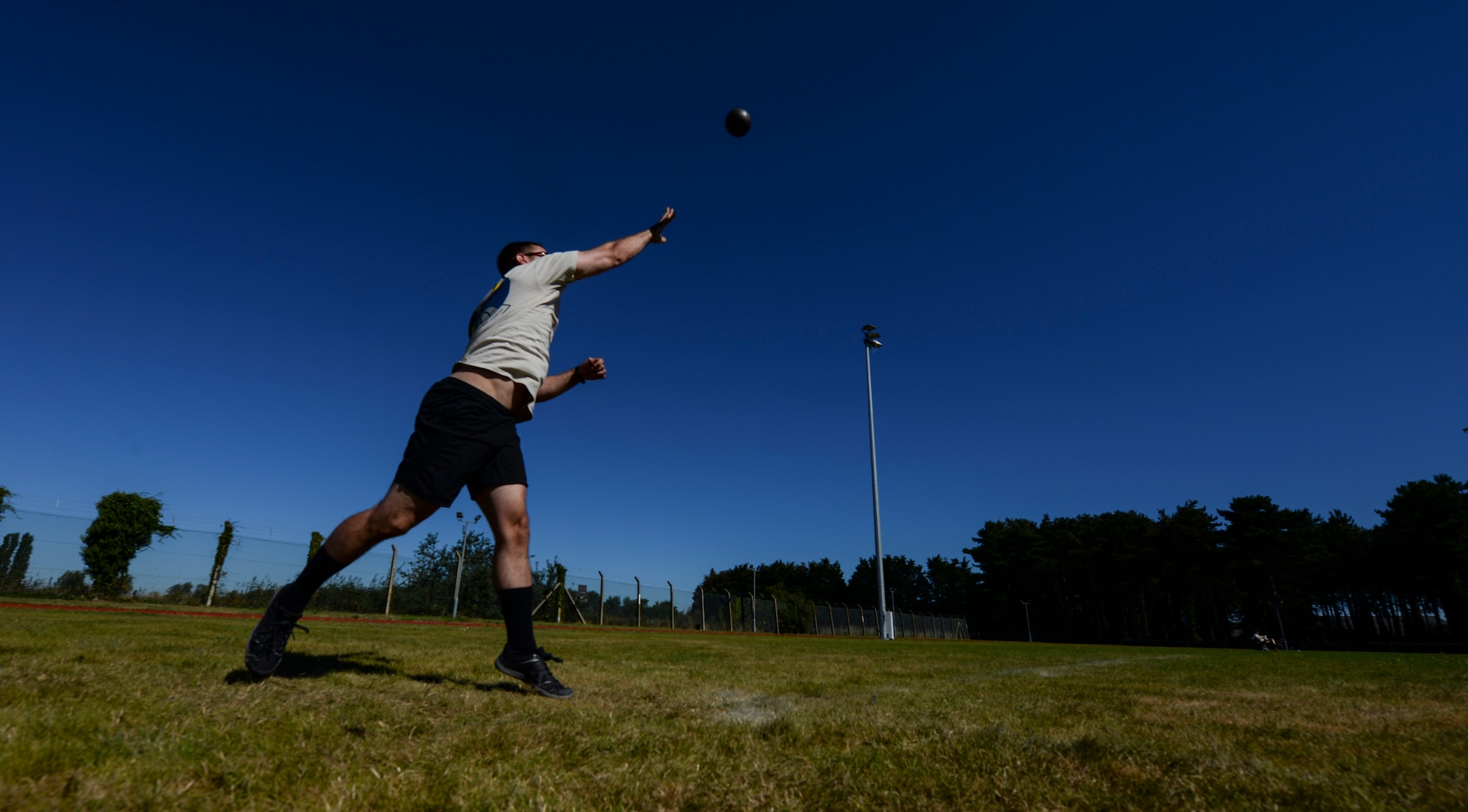 An Air commando from the 352d Special Operations Wing throws a shot during the Highland Games Sports and Family Day Aug. 26, 2016, on RAF Mildenhall, England. Other sporting events held during the competition included a leadership relay, dodgeball, caber toss, ultimate rugby, kettle bell throw and an obstacle course relay. (U.S. Air Force photo by Staff Sgt. Micaiah Anthony)