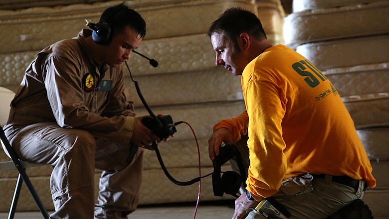 Lance Cpl. Nicholas Jordan, a rifleman with search and extraction platoon, Chemical Biological Incident Response Force, CBIRF, uses a wired life detector with seismic sensors under an instructor’s guidance during Exercise Scarlet Response 2016 at Guardian Centers, Perry, Ga., Aug. 23, 2016. This exercise is the unit’s capstone event, testing the levels of each individual CBIRF capability with lane training and culminating with a 36-hour simulated response to a nuclear detonation. CBIRF is an active duty Marine Corps unit that, when directed, forward-deploys and/or responds with minimal warning to a chemical, biological, radiological, nuclear or high-yield explosive threat or event in order to assist local, state, or federal agencies and the geographic combatant commanders in the conduct of CBRNE response or consequence management operations, providing capabilities for command and control; agent detection and identification; search, rescue, and decontamination; and emergency medical care for contaminated personnel.