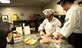 Airman 1st Class Tiffany Cristo, 92nd Force Support Squadron food services apprentice, and Airman 1st Class Marina Ericson, 92nd FSS food services apprentice, prepare food for boxed meals, Aug. 24, 2016, at Fairchild Air Force Base. The flight kitchen offers an online order form through the base’s SharePoint, so Airmen can see what foods are available and place an order. (U.S. Air Force photo/Airman 1st Class Sean Campbell)