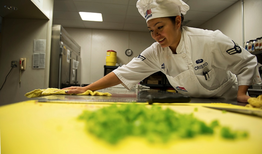 Airman 1st Class Tiffany Cristo, 92nd Force Support Squadron food services apprentice, cleans the flight kitchen Aug. 30, 2016, at Fairchild Air Force Base. The supplemental options in the boxed meals are often pre-contained food items such as individual packages of raisins and granola bars. For the entrées, the kitchen makes several different types of sandwiches including turkey, ham and peanut butter and jelly. (U.S. Air Force photo/Airman 1st Class Sean Campbell)