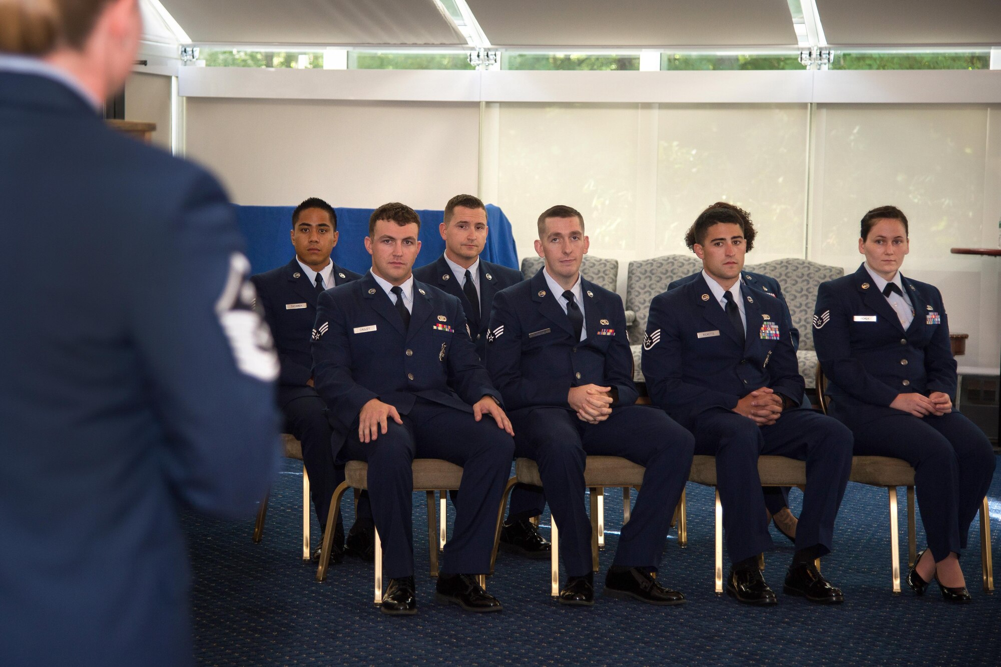 Airmen listen as Master Sgt. Jessica LaBrie, 66th Air Base Group first sergeant, speaks to them during the Monthly Enlisted Promotion Ceremony at the Minuteman Commons Aug. 30. Enlisted Airmen selected for promotion in September were recognized during the promotion ceremony. (U.S. Air Force photo by Mark Herlihy)