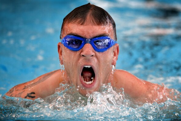 Michael Morris, 2nd Space Operations Squadron, takes a breath while swimming during the 12th annual Schriever Air Force Base Triathlon at Schriever Air Force Base, Colorado, Friday, Aug. 26, 2016. All competitors had to swim 400 meters, bicycle 12 miles and run 3.1 miles to complete the event. (U.S. Air Force photo/Dennis Rogers)