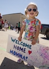 A child awaits her mother’s return at Dock 9 at Minot Air Force Base, N.D., Aug. 29, 2016. The 69th Bomb Squadron returned home after a six-month deployment to Andersen Air Force Base, Guam. (U.S. Air Force photo/Airman 1st Class J.T. Armstrong)