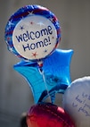 Balloons are held by family members of a deployed Airman at Minot Air Force Base, N.D., Aug. 29, 2016. Family members awaited the 69th Bomb Squadron’s return home after a six-month deployment to Andersen Air Force Base, Guam. (U.S. Air Force photo/Airman 1st Class J.T. Armstrong)