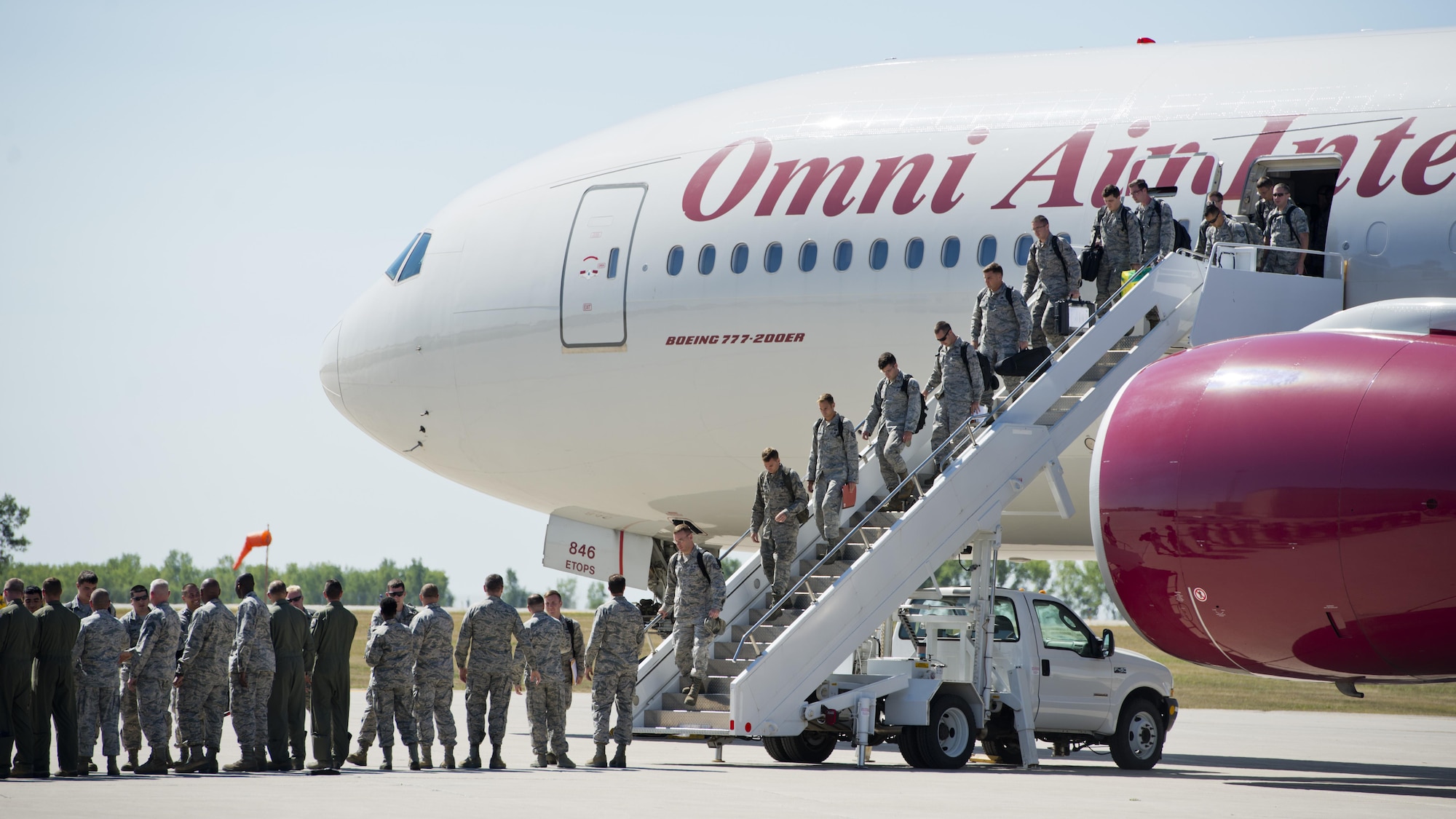 Members of the 5th Bomb Wing exit an aircraft at Minot Air Force Base, N.D., Aug. 29, 2016. The 5th BW Airmen were deployed to Andersen Air Force Base, Guam, in support of the continuous bomber presence. (U.S. Air Force photo/Airman 1st Class J.T. Armstrong)