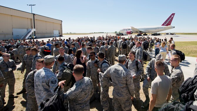 Team Minot family and friends greet Airmen at Dock 9 at Minot Air Force Base, N.D., Aug. 29, 2016. The six-month deployment was the unit’s last for a while to Andersen Air Force Base, Guam, before they begin supporting Central Command’s mission in the Middle East. (U.S. Air Force photo/Airman 1st Class J.T. Armstrong)