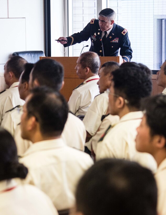 Col. Luis Pomales, director, Army Reserve Engagement Team-Japan, outlines the capabilities of the U.S. Army Reserve during a briefing with approximately 60 Japan Ground Self-Defense Force Reserve Component service members at Camp Ichigaya, Japan, Aug. 29, 2016. Pomales also presented ARET-J’s recent efforts in demonstrating the Army Reserve’s commitment in the Pacific through the enhancement U.S. Army Japan’s Drilling Individual Mobilization Augmentee program and the integration of Reserve military police specialists from the 200th Military Police Command with their active duty counterparts at USARJ. (U.S. Army photo by Sgt. John Carkeet, U.S. Army Japan)