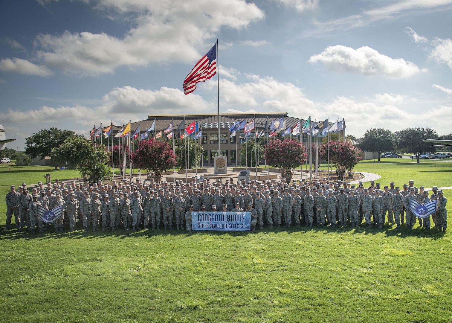 Joint Base San Antonio-Lackland staff sergeant selectees gather for a group photo after being notified of their selection Aug. 25, 2016 at JBSA-Lackland. Out of 39,064 eligible senior airmen, 16,506 were selected for promotion with a selection rate of 42.25 percent.  