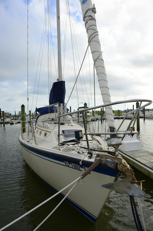 A sailboat sits docked at the “Marker 27” Marina at Langley Air Force Base, Va., Aug. 29, 2016. In accordance with Virginia law, the marina insists that any person operating a boat have a Virginia safety boating license from the Department of Game and Land Fisheries. (U.S. Air Force photo by Airman 1st Class Kaylee Dubois)