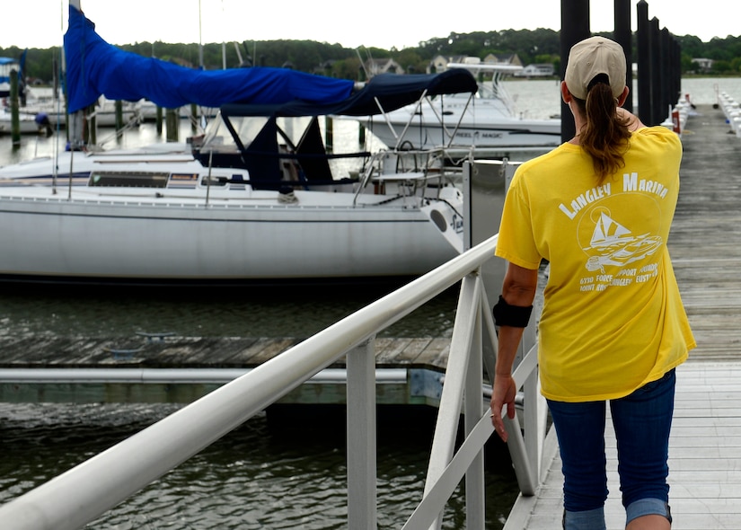 Amy Wood, 633rd Force Support Squadron marina staff member, provides information about the amenities available at the marina at Langley Air Force Base, Va., Aug. 29, 2016. The marina can store boats up to 32 feet in length in one of the 93 dry slips or 70 wet slips available. (U.S. Air Force photo by Airman 1st Class Kaylee Dubois)