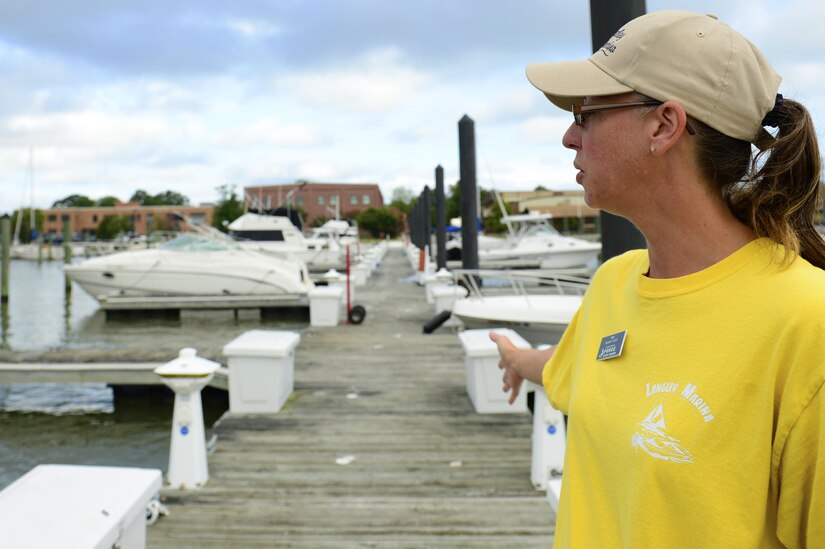 Amy Wood, 633rd Force Support Squadron marina staff member, explains the procedure for inclement weather at the marina at Langley Air Force Base, Va., Aug. 29, 2016. The marina will relocate the boats to a designated area within 48 hours of a storm. (U.S. Air Force photo by Airman 1st Class Kaylee Dubois)