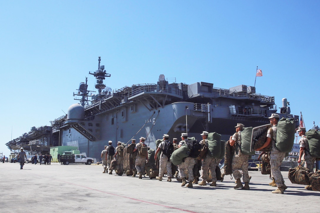 Marines with Task Force Los Angeles prepare to board the USS America at Naval Base San Diego, Calif., Aug. 29, 2016. The ship will carry Marines, sailors, and Coast Guardsmen to Fleet Week in Los Angeles, Sept. 2 -- Sept. 5.  Marine Corps photo by Lance Cpl. Caitlin Bevel