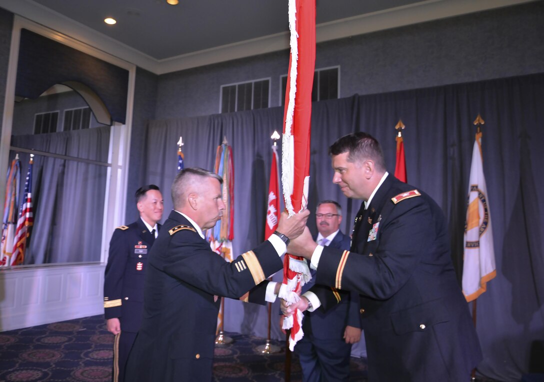 Lt. Gen. Todd Semonite, 54th Chief of Engineers and the USACE Commanding General, accepts the USACE flag from Col. Benjamin Bigelow, outgoing LRD Commander, during the LRD Change of Command Ceremony on August 31, 2016.   