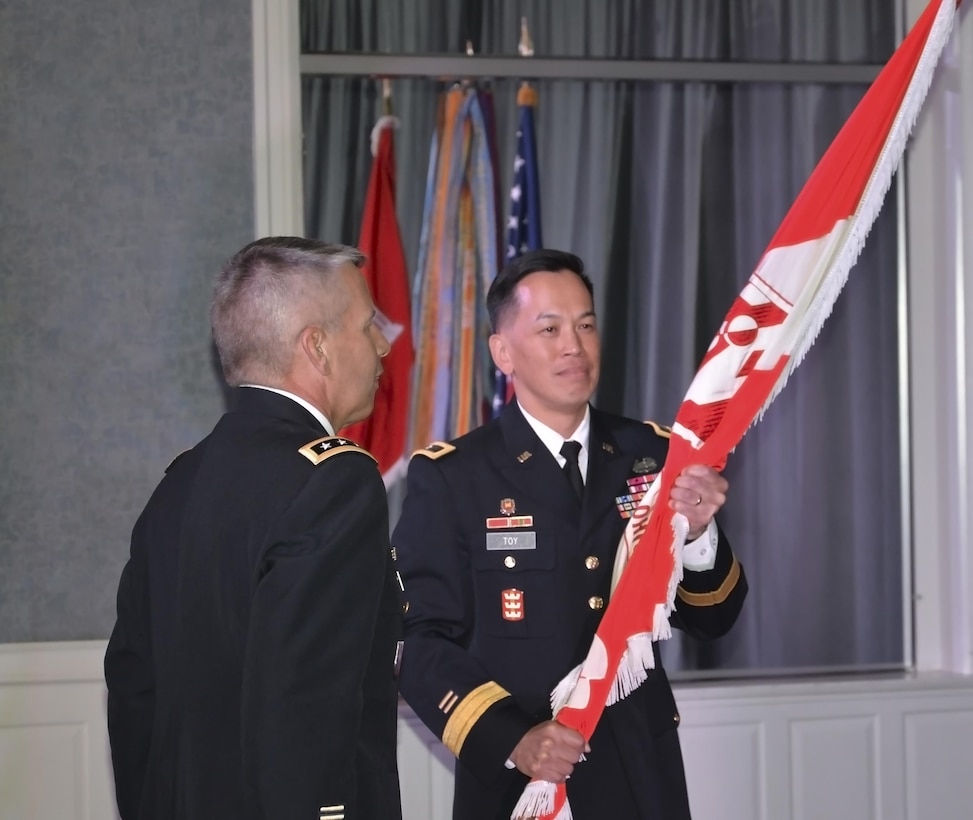 Brig. Gen. Mark Toy holds the USACE flag during the LRD Change of Command Ceremony in Cincinnati on August 31, 2016.