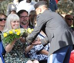 Laura Buchanan, wife of Lt. Gen. Jeffrey S. Buchanan, receives roses from a U.S. Army North Soldier to welcome her to the ARNORTH family during the ARNORTH change of command ceremony at the Fort Sam Houston Quadrangle Friday. 