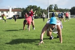 U.S. Army Staff Sgt. Krista Ihde, 341st Training Squadron Advanced Individual Training platoon sergeant, and other participants perform bear crawls during a Camp Gladiator workout Aug. 27, 2016 at the Rambler Fitness Center Track. The event featured four 20-minute stations, each representing a different week of the Camp Gladiator program.
