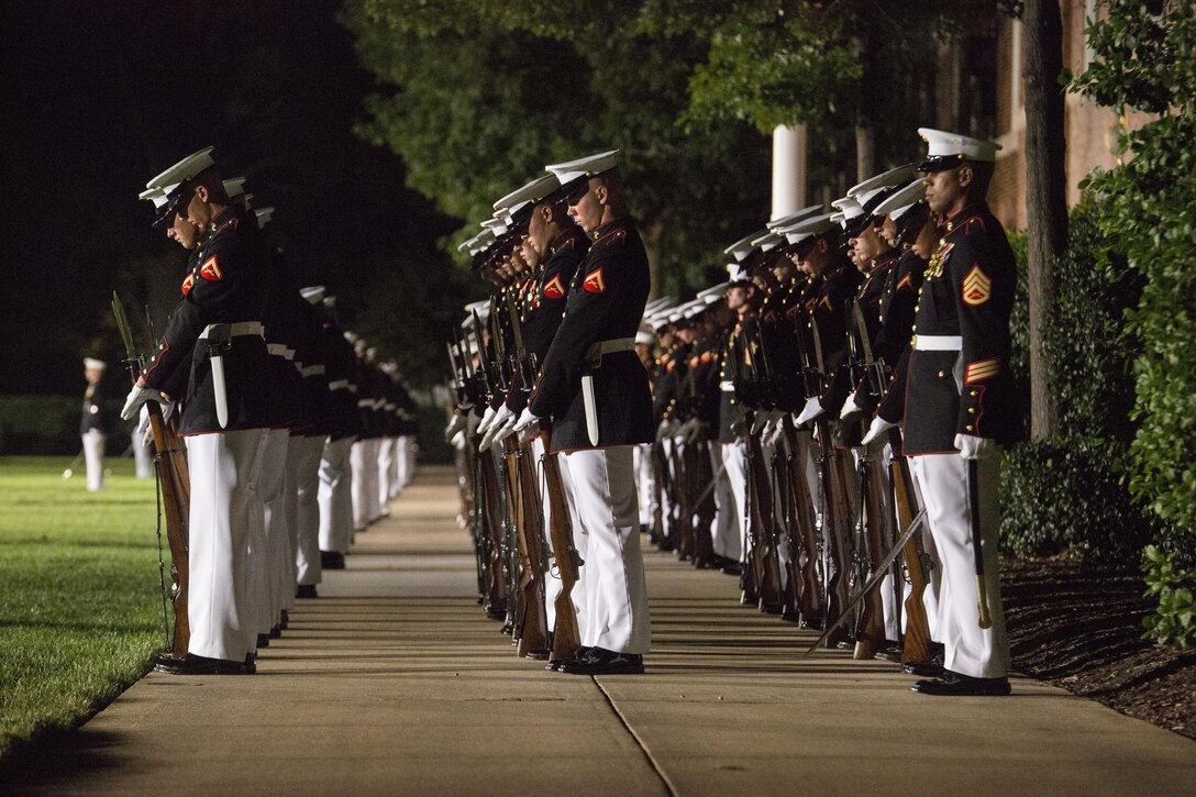 Marines of Marine Barracks Washington, D.C., execute the command "fix bayonets" during the Evening Parade at Marine Barracks Washington, D.C., Aug. 26, 2016. The guest of honor for the parade was the Honorable Ashton B. Carter, Secretary of Defense, and the hosting official was Gen. Robert B. Neller, commandant of the Marine Corps. (Official Marine Corps photo by Cpl. Andrianna Daly/Released)