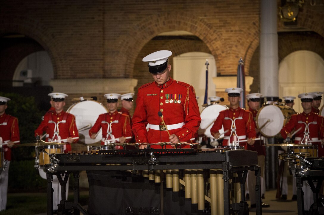 The United States Marine Drum and Bugle Corps performs during the Evening Parade at Marine Barracks Washington, D.C., Aug. 26, 2016. The guest of honor for the parade was the Honorable Ashton B. Carter, Secretary of Defense, and the hosting official was Gen. Robert B. Neller, commandant of the Marine Corps. (Official Marine Corps photo by Cpl. Andrianna Daly/Released)