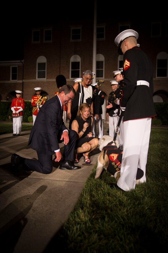 The Honorable Ashton B. Carter, Secretary of Defense and his wife, Stephanie Carter, greet the official Marine Corps mascot, Cpl. Chesty XIV, at the end of the evening parade at Marine Barracks Washington Aug. 26, 2016. The guest of honor for the parade was the Honorable Ashton B. Carter, Secretary of Defense, and the hosting official was Gen. Robert B. Neller, commandant of the Marine Corps. (Official Marine Corps photo by Cpl. Andrianna Daly/Released)